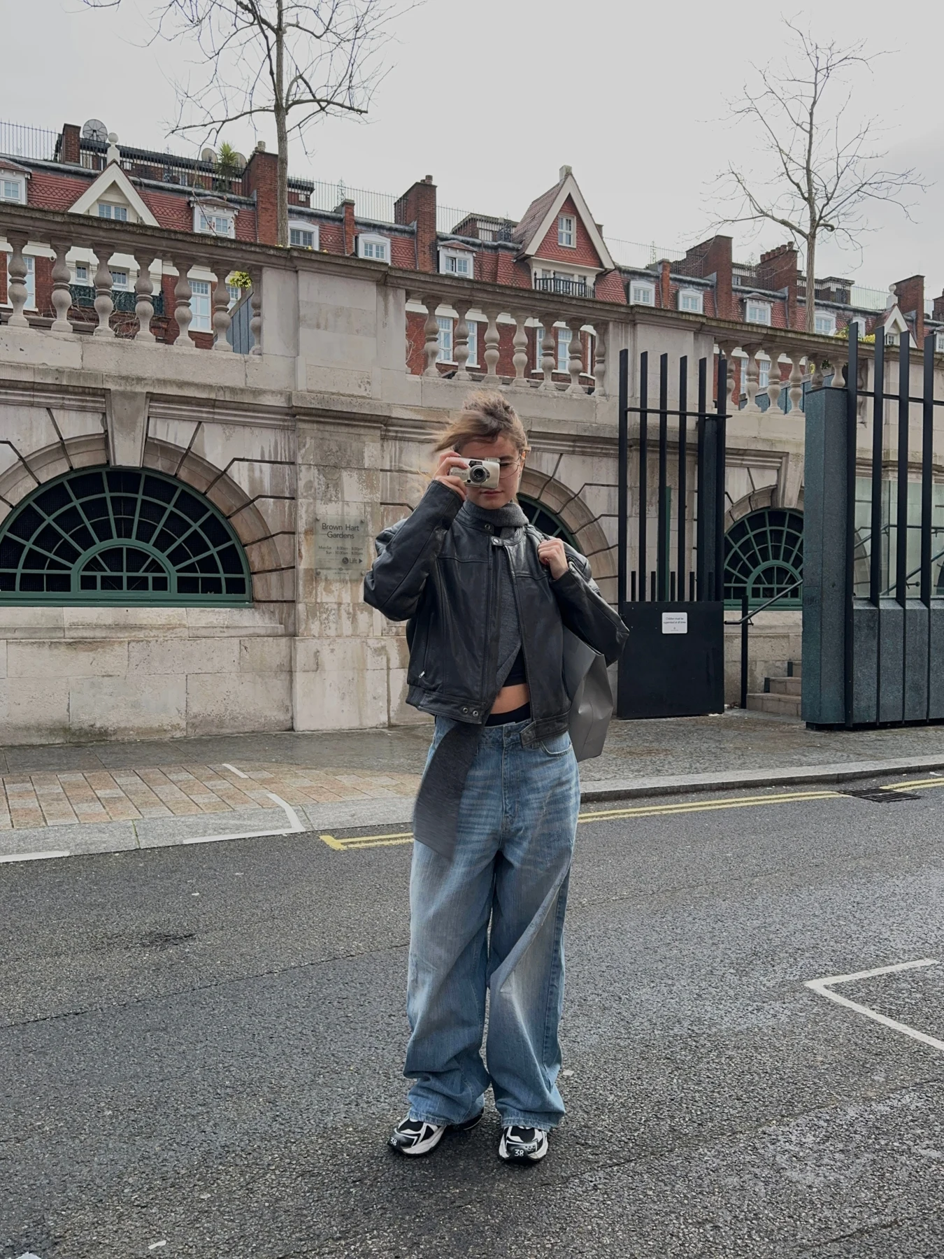 Augusta standing outside a London station